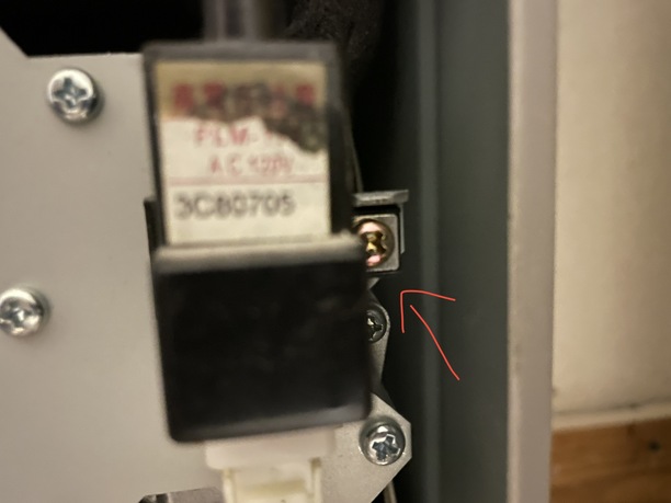 closeup of the screw holding the igniter switch