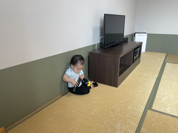 baby Joseph exploring the hotel room