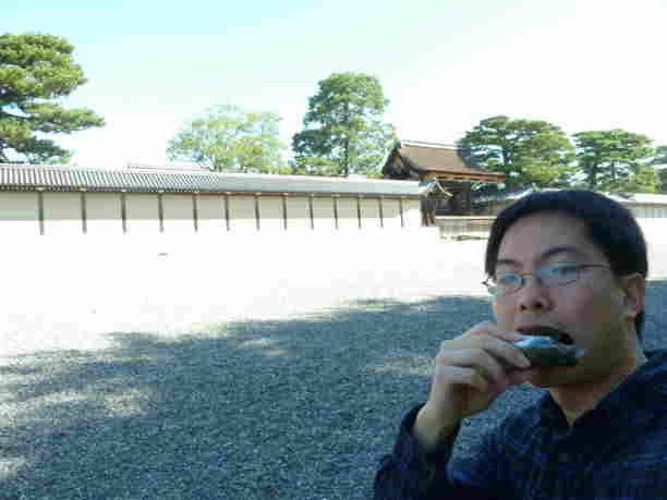 Eating onigiri in front of the Imperial Palace