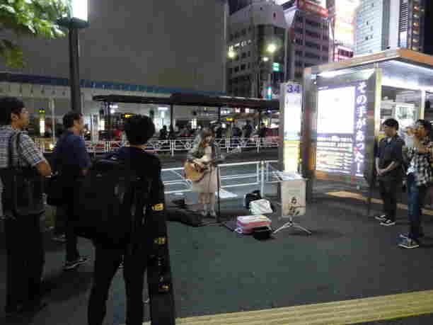 Street Singer at night - I wish I had some cash to give her