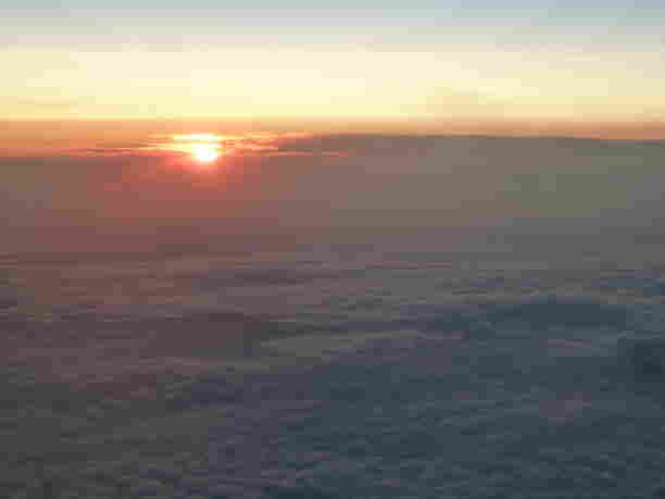 The beautiful sunset above the clouds as we left for Europe